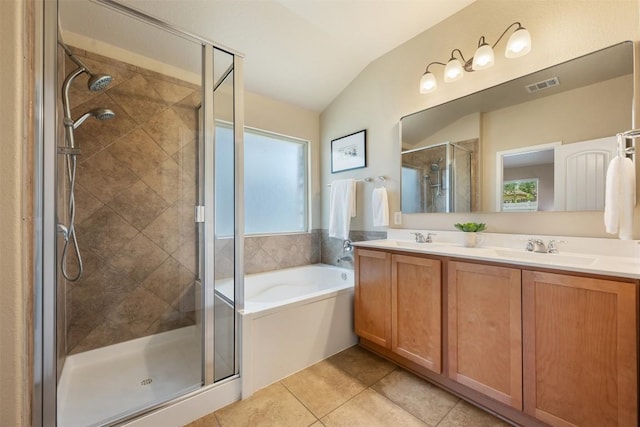 19105 Obed River Dr, Pflugerville, TX 78660 - full bath with lofted ceiling, a stall shower, a garden tub, healthy amount of natural light, and double vanity