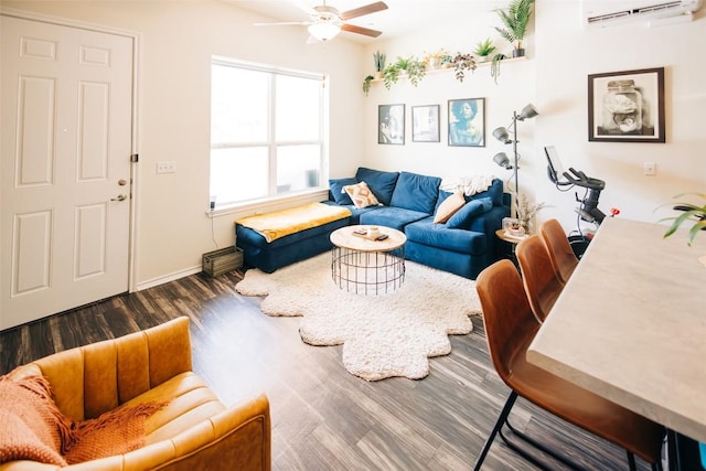 8601 W Gate Blvd Unit 4103, Austin, TX 78745 - living area featuring a wall unit AC, a ceiling fan, and wood finished floors