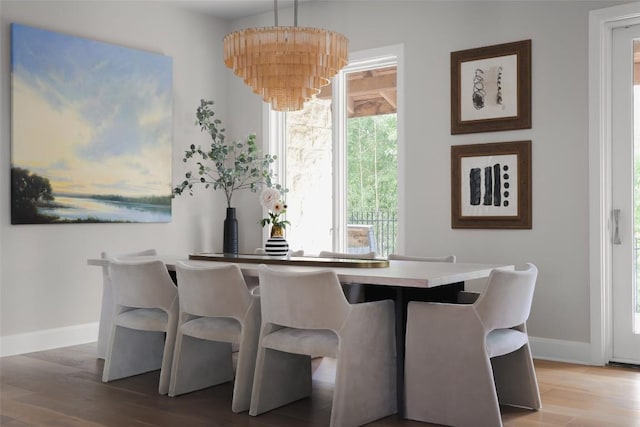 114 Medalist St, Lakeway, TX 78734 - dining space with light wood finished floors and a chandelier