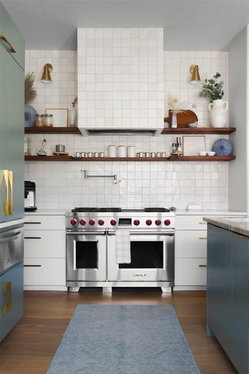 114 Medalist St, Lakeway, TX 78734 - kitchen with double oven range, exhaust hood, tasteful backsplash, and open shelves