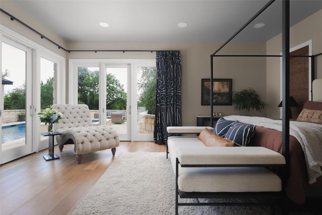 114 Medalist St, Lakeway, TX 78734 - bedroom featuring access to outside, light wood-style floors, recessed lighting, and french doors