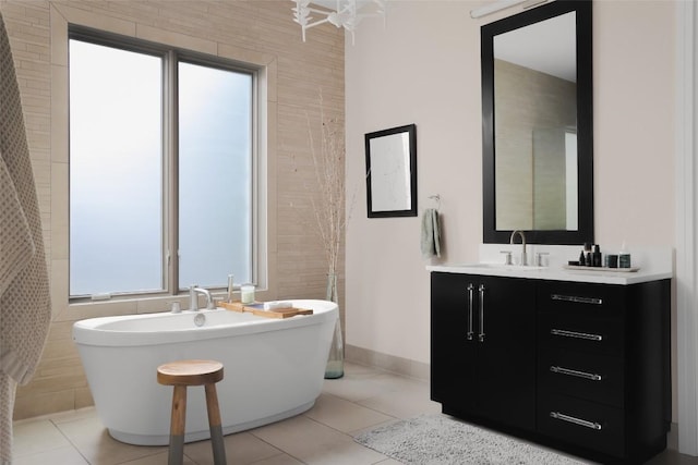 114 Medalist St, Lakeway, TX 78734 - full bathroom featuring double vanity, a freestanding tub, and healthy amount of natural light