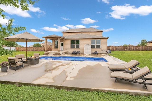 123 Brittany Ln, Bastrop, TX 78602 - rear view of house with a fire pit, a fenced backyard, and a patio