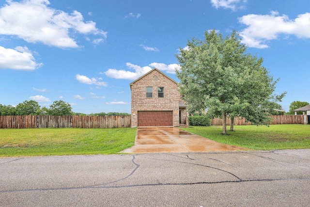 123 Brittany Ln, Bastrop, TX 78602 - traditional home featuring a garage, driveway, and brick siding