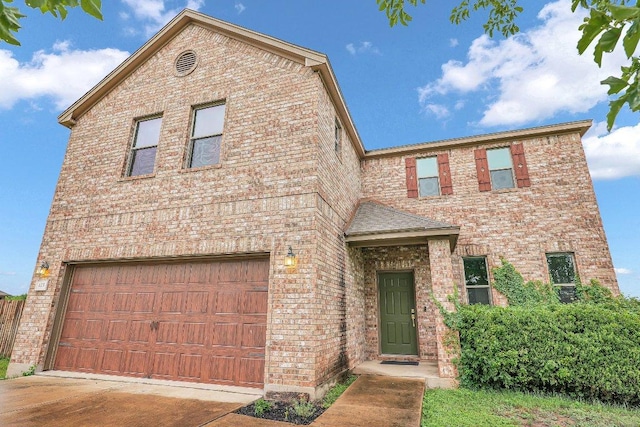 123 Brittany Ln, Bastrop, TX 78602 - view of front facade featuring brick siding and a garage