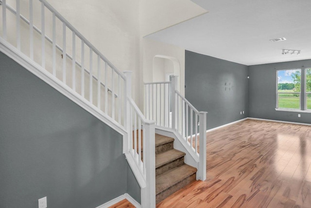 123 Brittany Ln, Bastrop, TX 78602 - stairs featuring wood finished floors and baseboards
