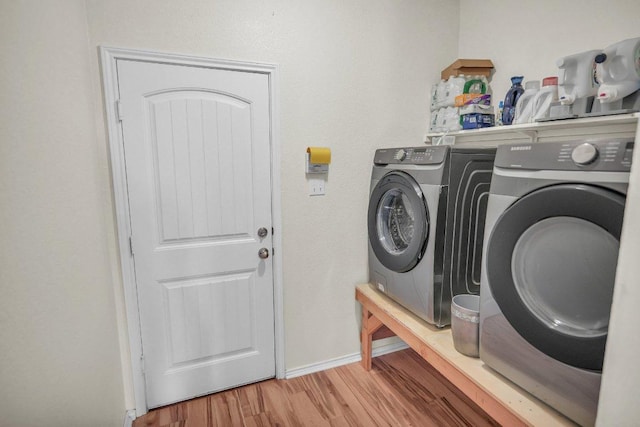 123 Brittany Ln, Bastrop, TX 78602 - washroom with independent washer and dryer and light wood-style flooring