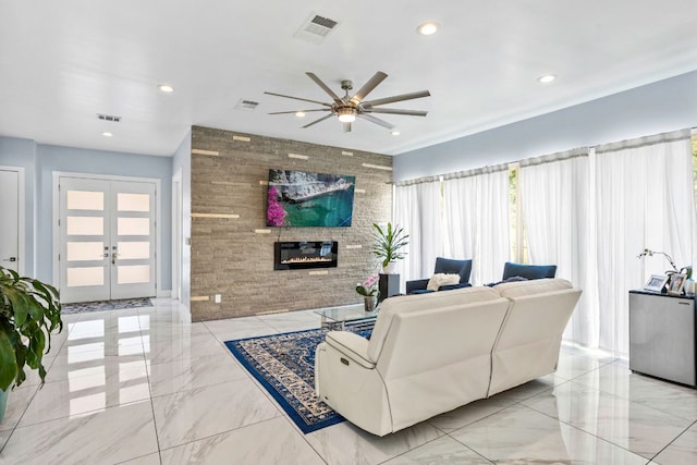 14430 Tuscola Cir, Austin, TX 78734 - living area featuring a ceiling fan, marble tiled flooring, french doors, a fireplace, and recessed lighting