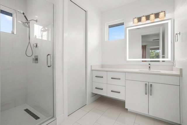 14430 Tuscola Cir, Austin, TX 78734 - bathroom featuring a stall shower, plenty of natural light, vanity, and tile patterned flooring