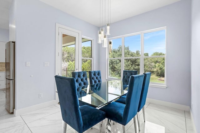 14430 Tuscola Cir, Austin, TX 78734 - dining space featuring a chandelier and light marble finish flooring
