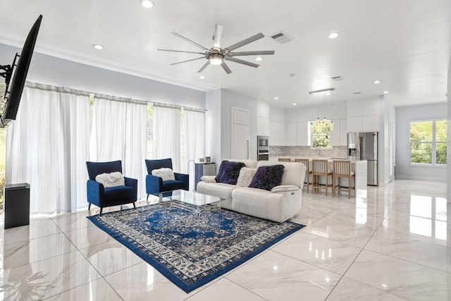 14430 Tuscola Cir, Austin, TX 78734 - living area featuring ceiling fan, recessed lighting, and light marble finish flooring