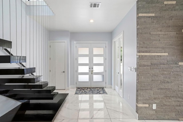 14430 Tuscola Cir, Austin, TX 78734 - foyer entrance featuring french doors, marble finish floors, and recessed lighting
