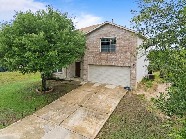 161 Prairie Verbena Dr, Kyle, TX 78640 - view of front of house with driveway, a garage, brick siding, and a front lawn