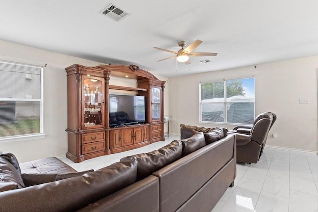 161 Prairie Verbena Dr, Kyle, TX 78640 - living area featuring light marble finish floors and a ceiling fan