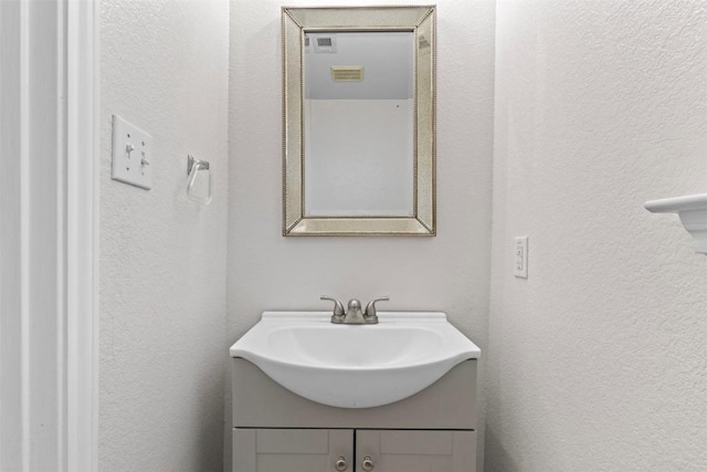 161 Prairie Verbena Dr, Kyle, TX 78640 - bathroom with a textured wall and vanity