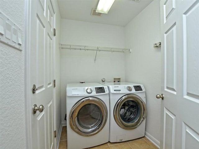 106 S Gadwall Ln, Cedar Park, TX 78613 - laundry room featuring washer and dryer and light tile patterned floors