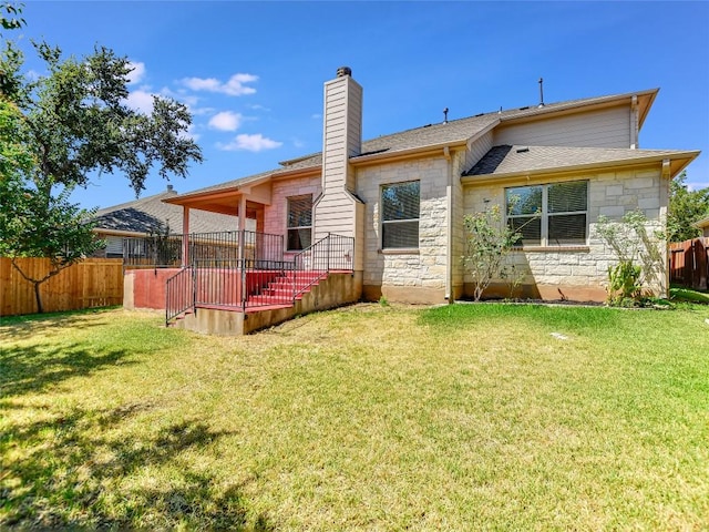 106 S Gadwall Ln, Cedar Park, TX 78613 - rear view of property featuring stone siding and a chimney