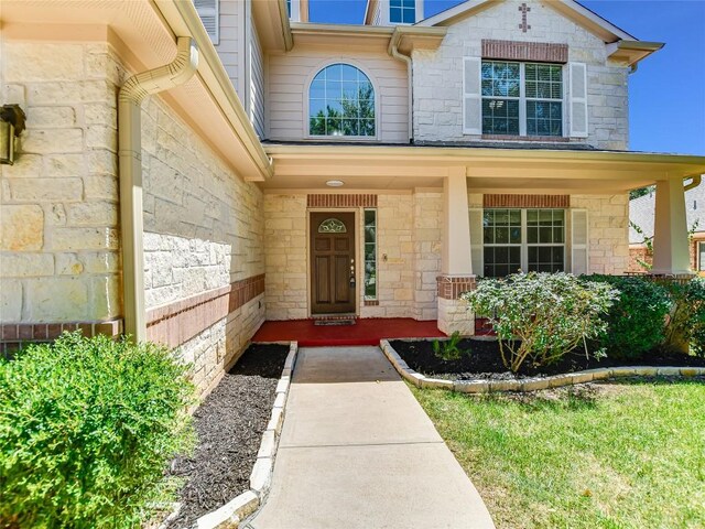 106 S Gadwall Ln, Cedar Park, TX 78613 - view of exterior entry featuring stone siding and a porch