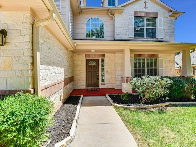 106 S Gadwall Ln, Cedar Park, TX 78613 - doorway to property featuring stone siding and covered porch