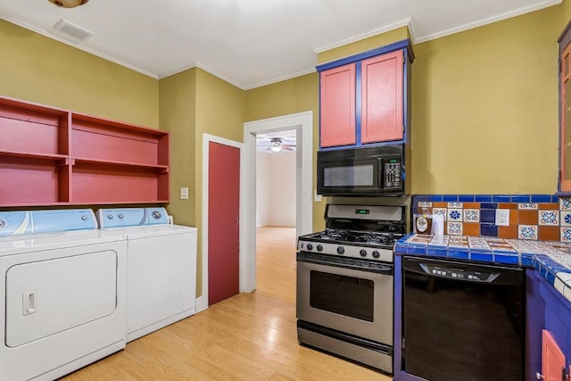 2834 Pearl St, Austin, TX 78705 - kitchen featuring black appliances, tile counters, washer and clothes dryer, light wood-style floors, and crown molding