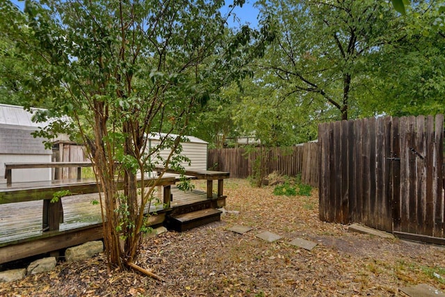 2834 Pearl St, Austin, TX 78705 - fenced backyard with a storage shed and a wooden deck