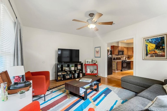 2834 Pearl St, Austin, TX 78705 - living room with ceiling fan, light wood-style flooring, and healthy amount of natural light