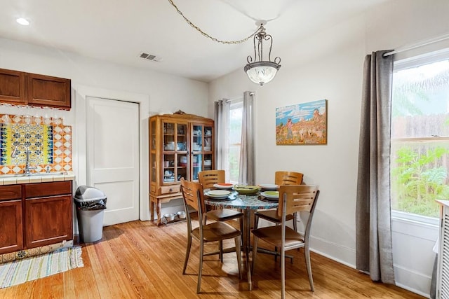 2834 Pearl St, Austin, TX 78705 - dining room with plenty of natural light and light wood finished floors