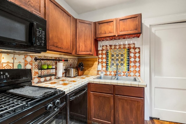 2834 Pearl St, Austin, TX 78705 - kitchen featuring black appliances, backsplash, and tile countertops