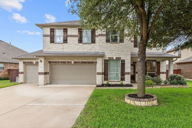 204 Lake Livingston Dr, Georgetown, TX 78628 - view of front of house featuring stone siding, a front yard, and concrete driveway
