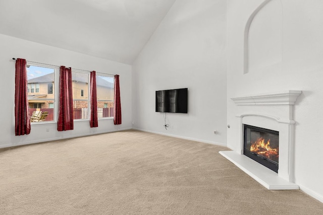 204 Lake Livingston Dr, Georgetown, TX 78628 - unfurnished living room with carpet flooring, high vaulted ceiling, and a glass covered fireplace
