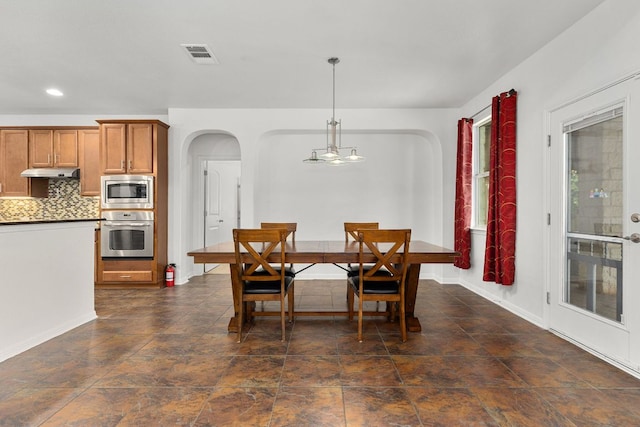 204 Lake Livingston Dr, Georgetown, TX 78628 - dining space with arched walkways and recessed lighting