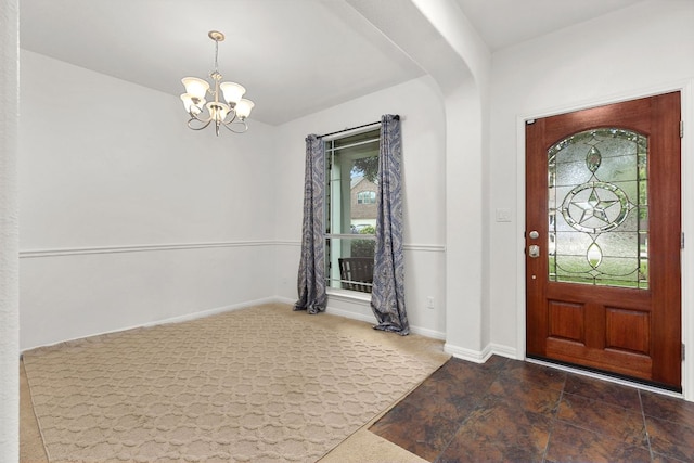 204 Lake Livingston Dr, Georgetown, TX 78628 - foyer entrance with a chandelier and dark stone finish floors