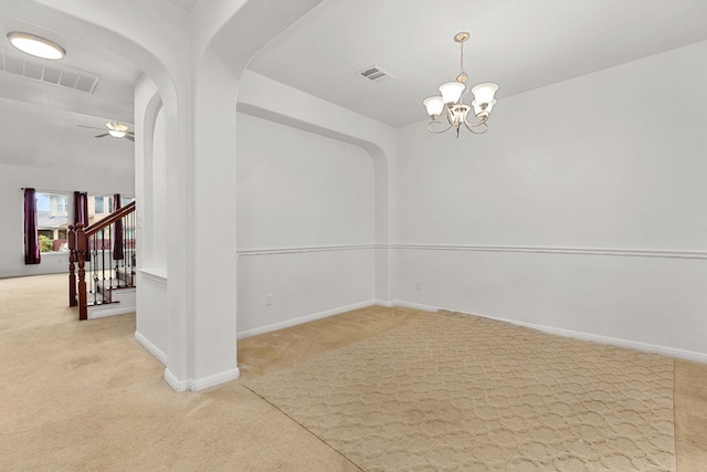 204 Lake Livingston Dr, Georgetown, TX 78628 - carpeted empty room with a chandelier, arched walkways, a ceiling fan, and stairs