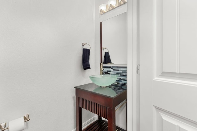 204 Lake Livingston Dr, Georgetown, TX 78628 - bathroom featuring decorative backsplash and vanity
