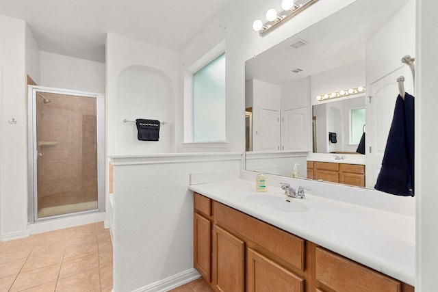 204 Lake Livingston Dr, Georgetown, TX 78628 - bathroom featuring vanity, a stall shower, and tile patterned floors