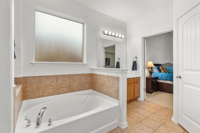204 Lake Livingston Dr, Georgetown, TX 78628 - bathroom with a bath, tile patterned flooring, vanity, and ensuite bathroom
