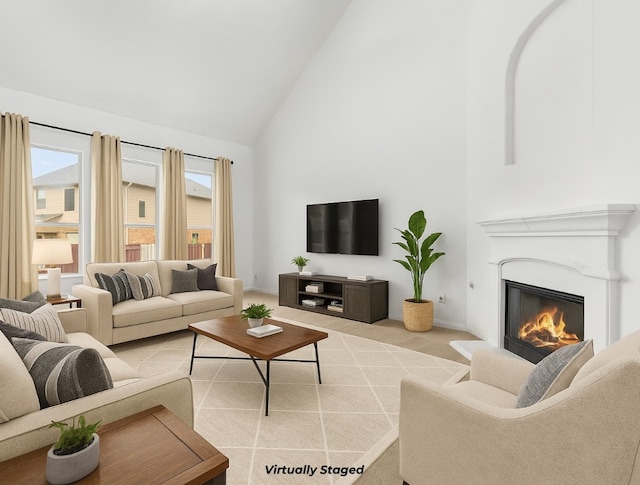 204 Lake Livingston Dr, Georgetown, TX 78628 - living room with high vaulted ceiling, a glass covered fireplace, healthy amount of natural light, and light colored carpet
