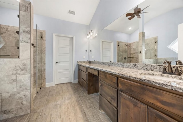 2660 Cowgirl Trl, Belton, TX 76513 - bathroom featuring ceiling fan, double vanity, a stall shower, and wood finished floors