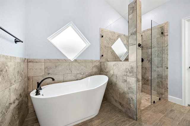 2660 Cowgirl Trl, Belton, TX 76513 - bathroom featuring a freestanding tub, a walk in shower, and tile walls