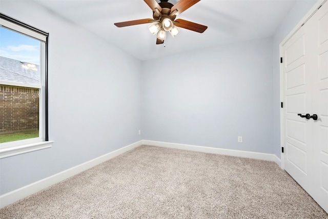 2660 Cowgirl Trl, Belton, TX 76513 - unfurnished bedroom featuring light carpet, multiple windows, and a ceiling fan