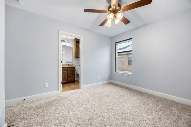 2660 Cowgirl Trl, Belton, TX 76513 - unfurnished bedroom featuring light colored carpet, ensuite bathroom, and a ceiling fan