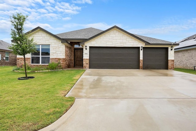 2660 Cowgirl Trl, Belton, TX 76513 - view of front facade with an attached garage, driveway, a front yard, and brick siding
