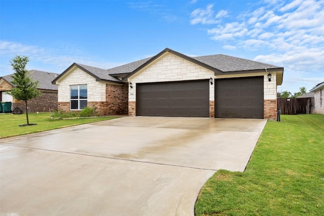 2660 Cowgirl Trl, Belton, TX 76513 - view of front facade with an attached garage, concrete driveway, brick siding, and a shingled roof