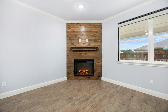 2660 Cowgirl Trl, Belton, TX 76513 - unfurnished living room featuring a large fireplace, ornamental molding, and wood finished floors