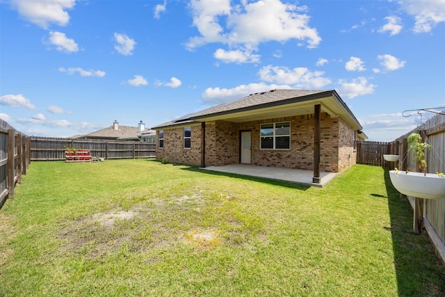 2660 Cowgirl Trl, Belton, TX 76513 - back of house featuring brick siding, a patio area, and a fenced backyard