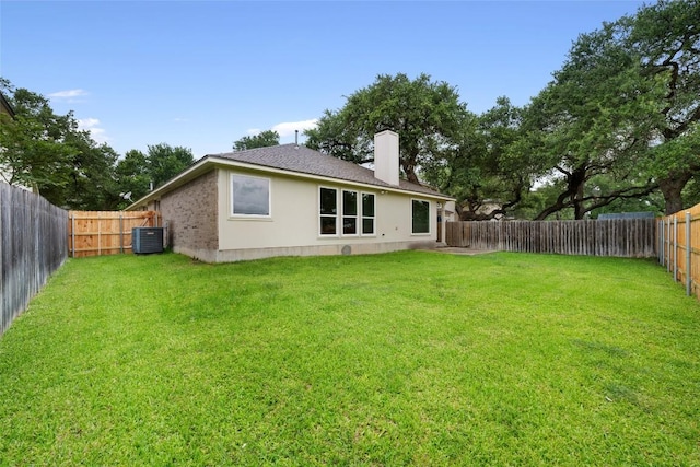 608 Haleys Cv, Leander, TX 78641 - back of house featuring a chimney, a fenced backyard, roof with shingles, and stucco siding