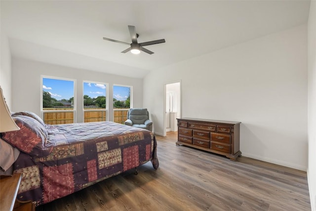 608 Haleys Cv, Leander, TX 78641 - bedroom with wood finished floors, lofted ceiling, and a ceiling fan