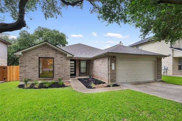 608 Haleys Cv, Leander, TX 78641 - view of front facade featuring a garage, brick siding, driveway, and a shingled roof