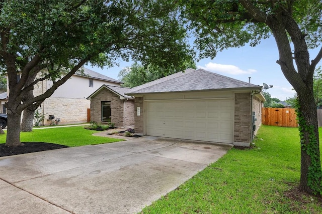 608 Haleys Cv, Leander, TX 78641 - ranch-style home with driveway, an attached garage, roof with shingles, and brick siding