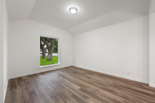 608 Haleys Cv, Leander, TX 78641 - empty room featuring lofted ceiling and wood finished floors